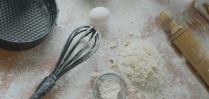 Baking ingredients are prepared on a floured surface